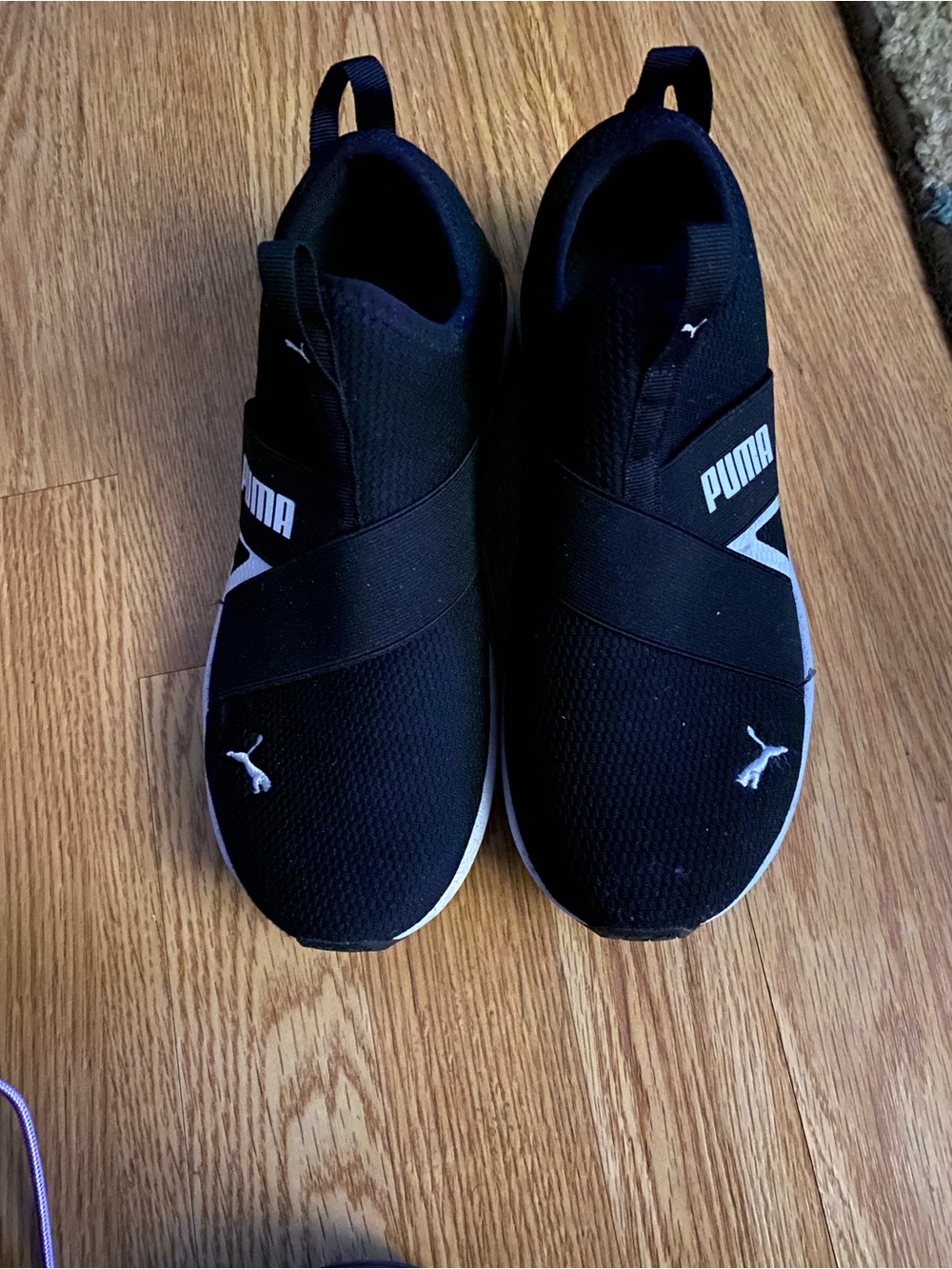 Puma Women’s Slip-On Athletic Sneakers in Black and White